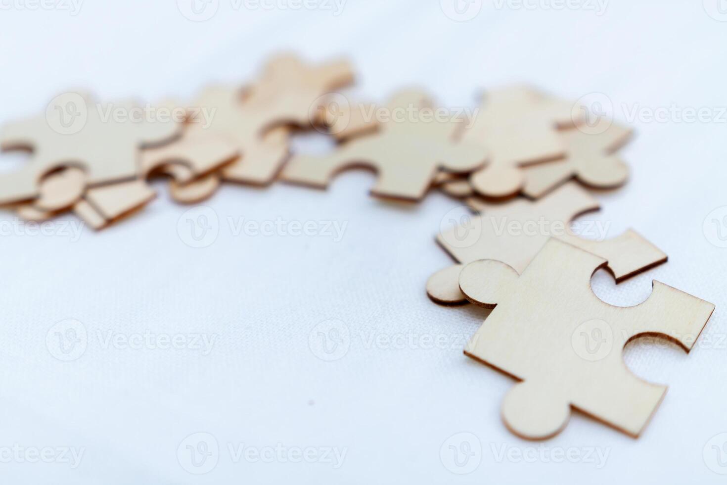 Strategic business puzzle solving collaborative workshop office space creative engagement teamwork top-down perspective problem-solving dynamics photo