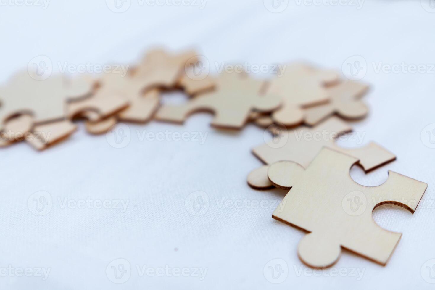 Puzzle pieces representing business strategy workspace visual concept engaging environment close-up collaboration and problem solving photo