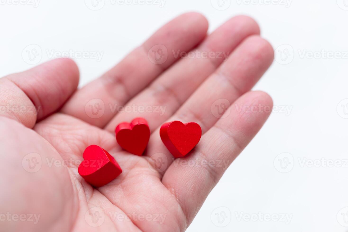 Business thank you gesture hand holding heart symbols emotional connection minimalist setting close-up view love and appreciation concept photo
