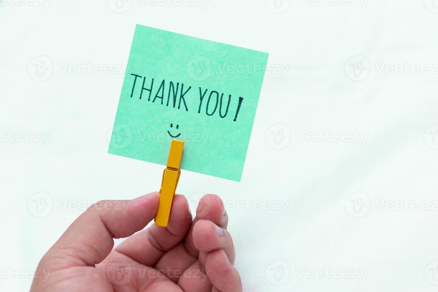 Thank you note in hand business context emotional connection simple setup close-up view gratitude in the workplace photo