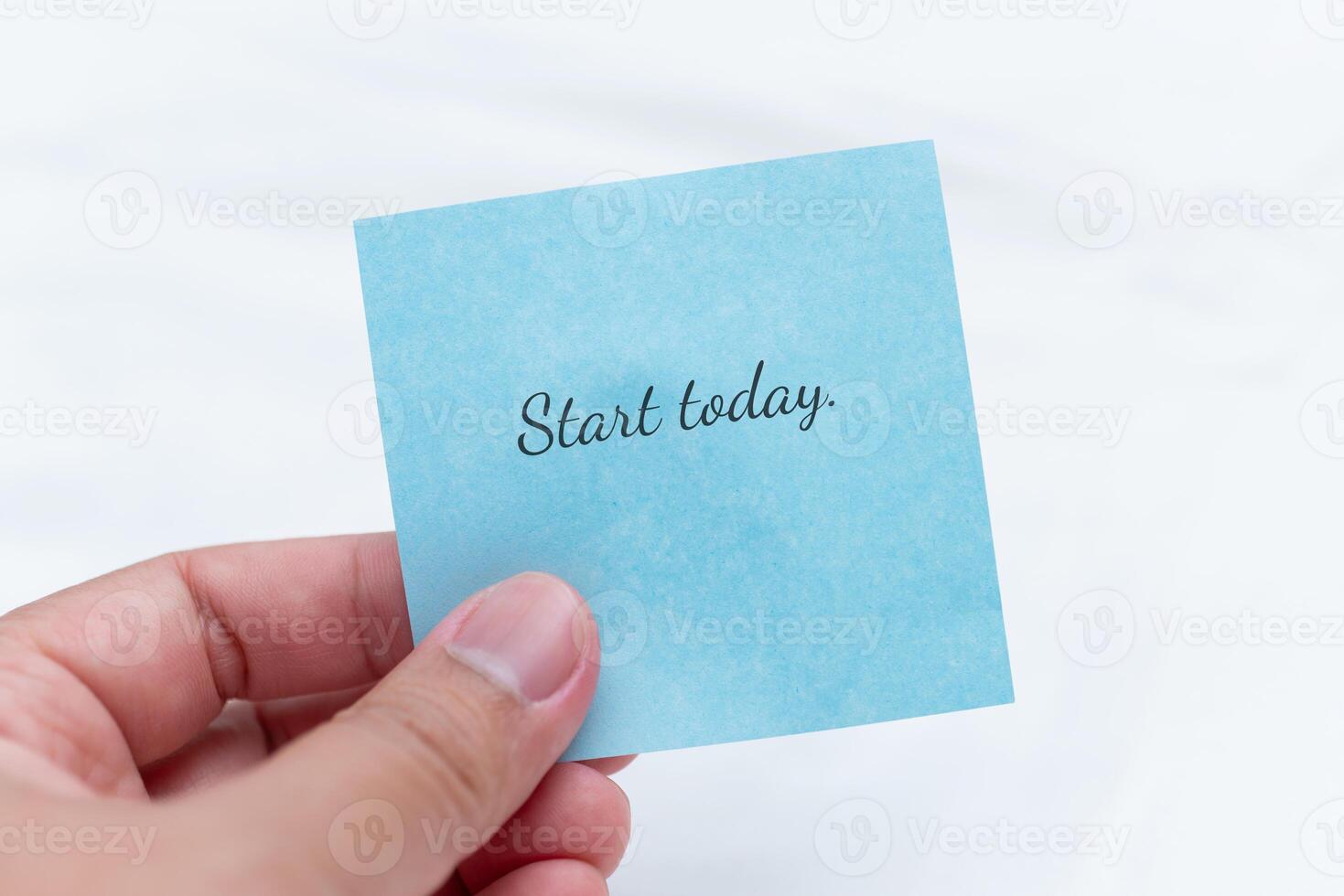 Motivational hand note with text to start today personal growth minimalist setting close-up view inspiration photo