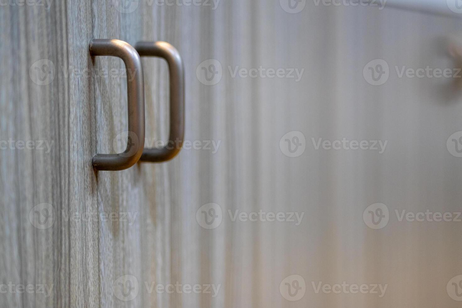 Artistic close-up of modern minimalist cabinet handle for functional interior design photo