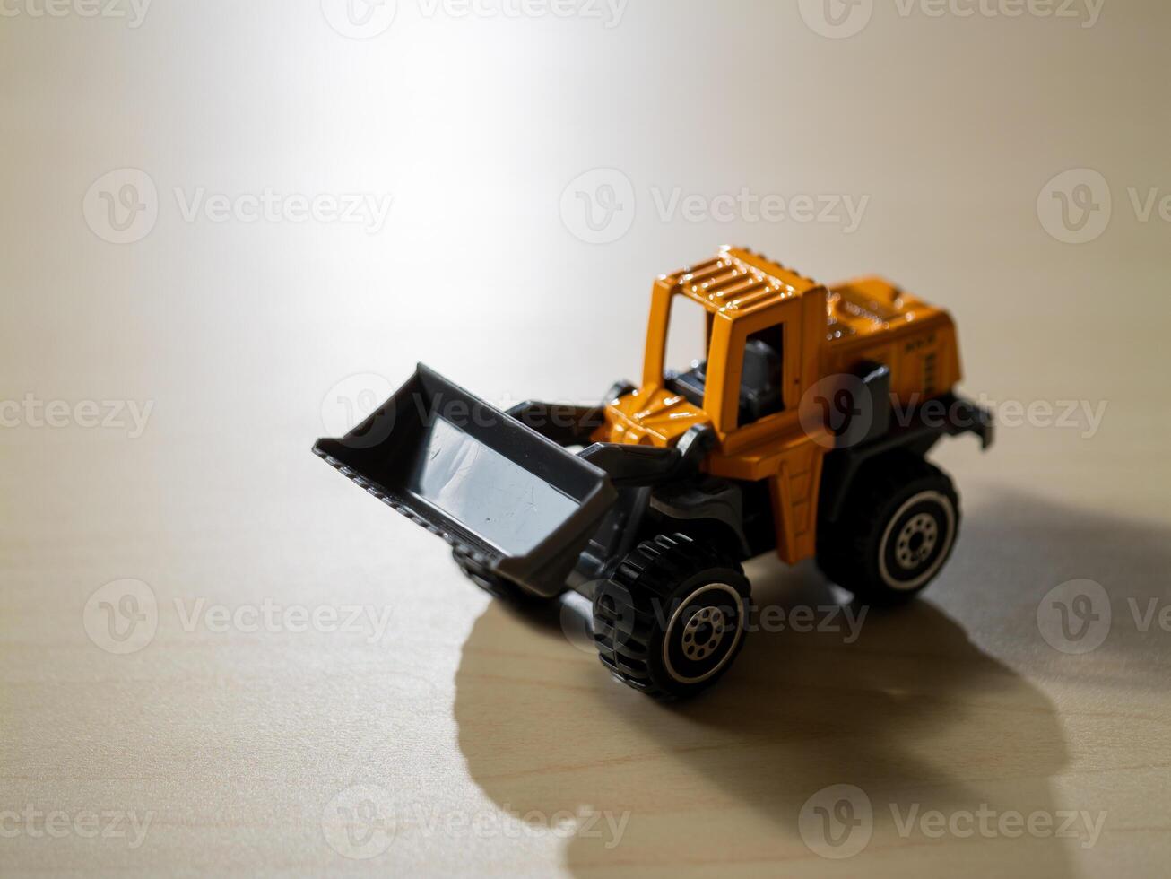 Close-up view of action mini bulldozer imaginative play with construction toy photo