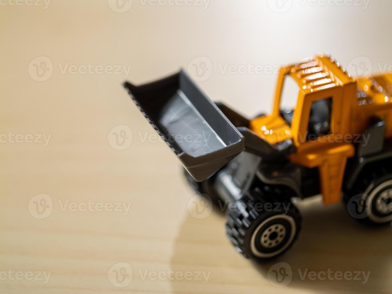 Close-up of toy construction vehicle in playroom boosting children's imagination photo