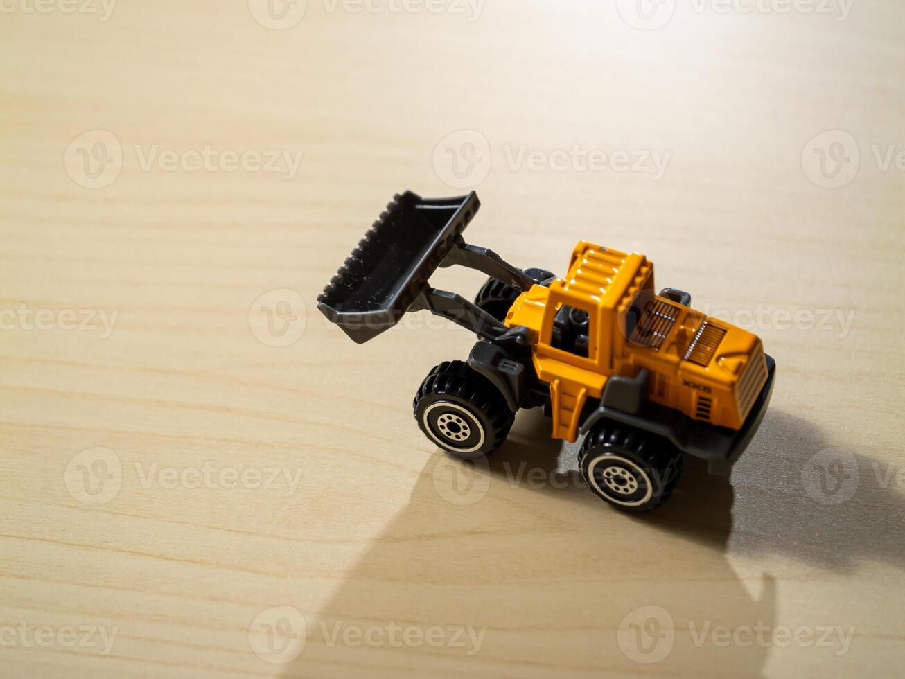 Spark imagination with toy construction vehicles in a joyful indoor environment photo