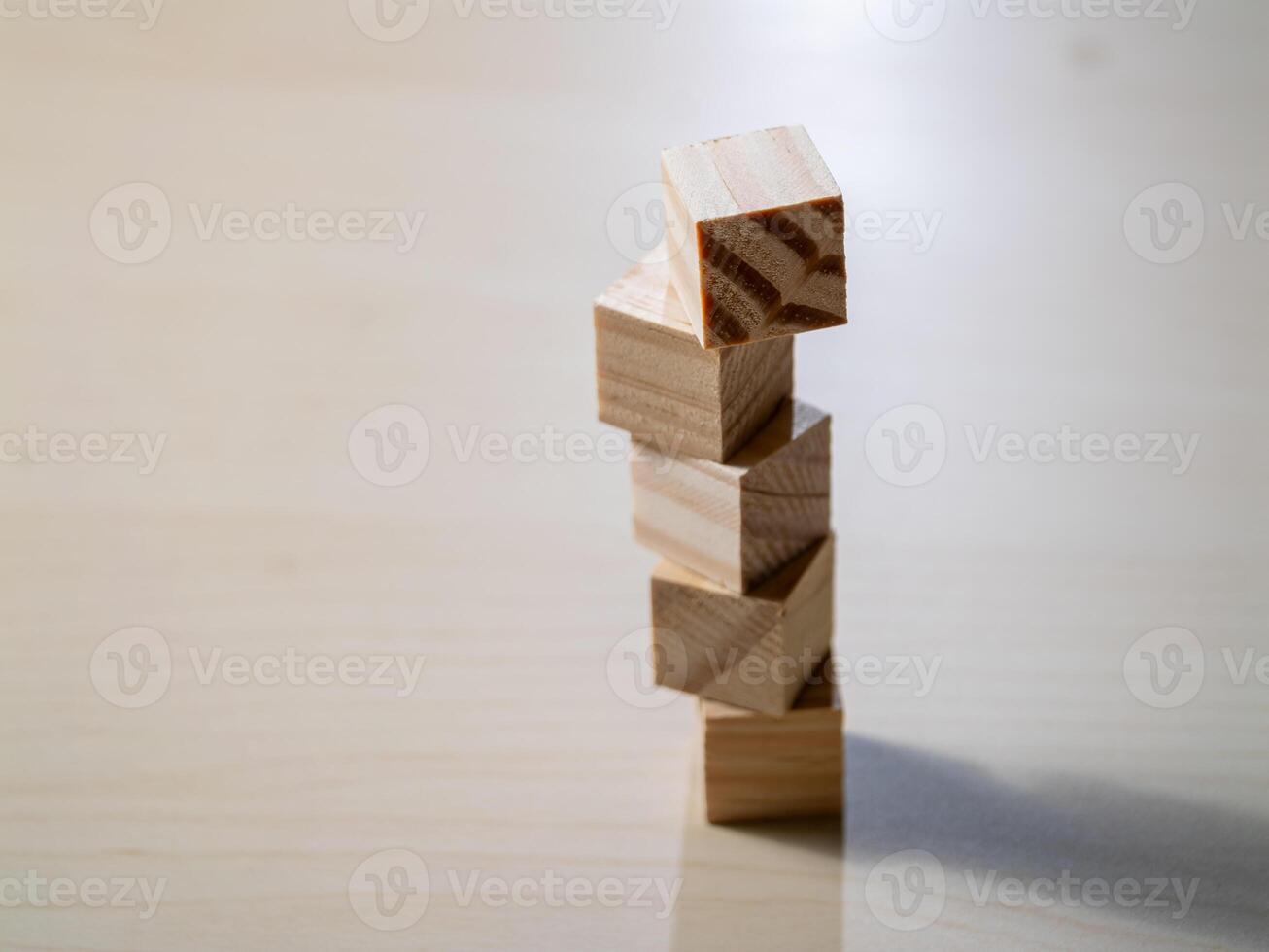 Building balance wooden blocks stacked in a minimalist home office setting photo