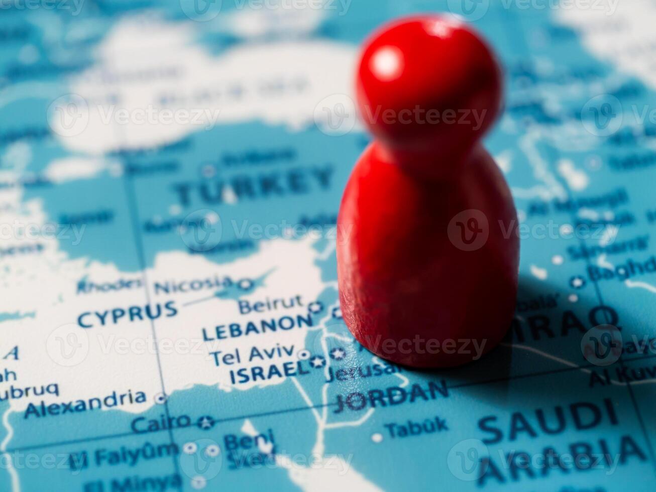 Exploring geopolitical landscapes a red marker on a map of the middle east photo