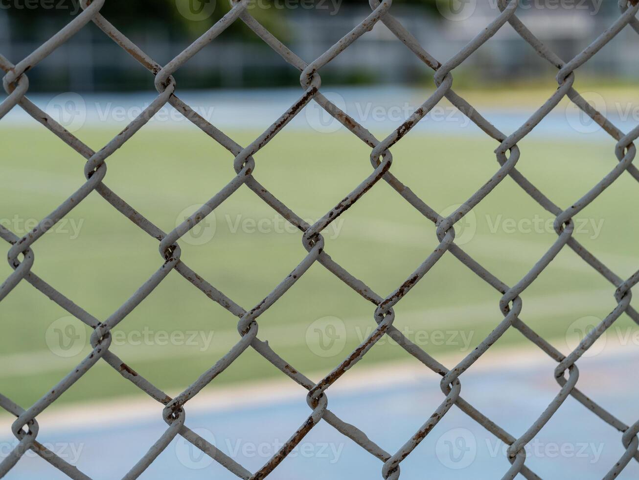 Tennis match preparations behind chain-link fence local court sports outdoor close-up anticipation photo