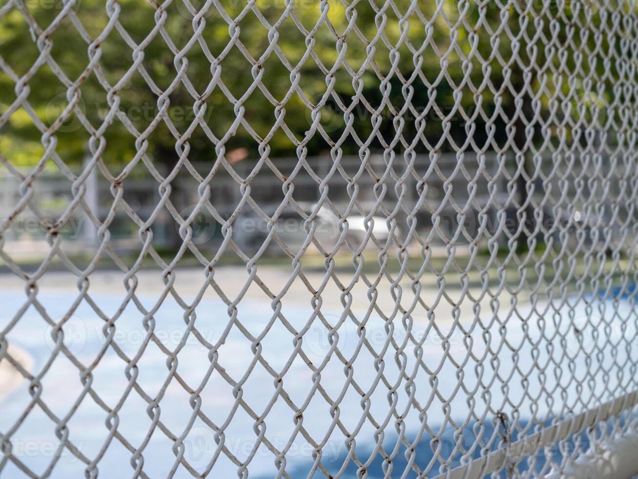 Close-up highlights of local basketball action behind the chain-link fence photo