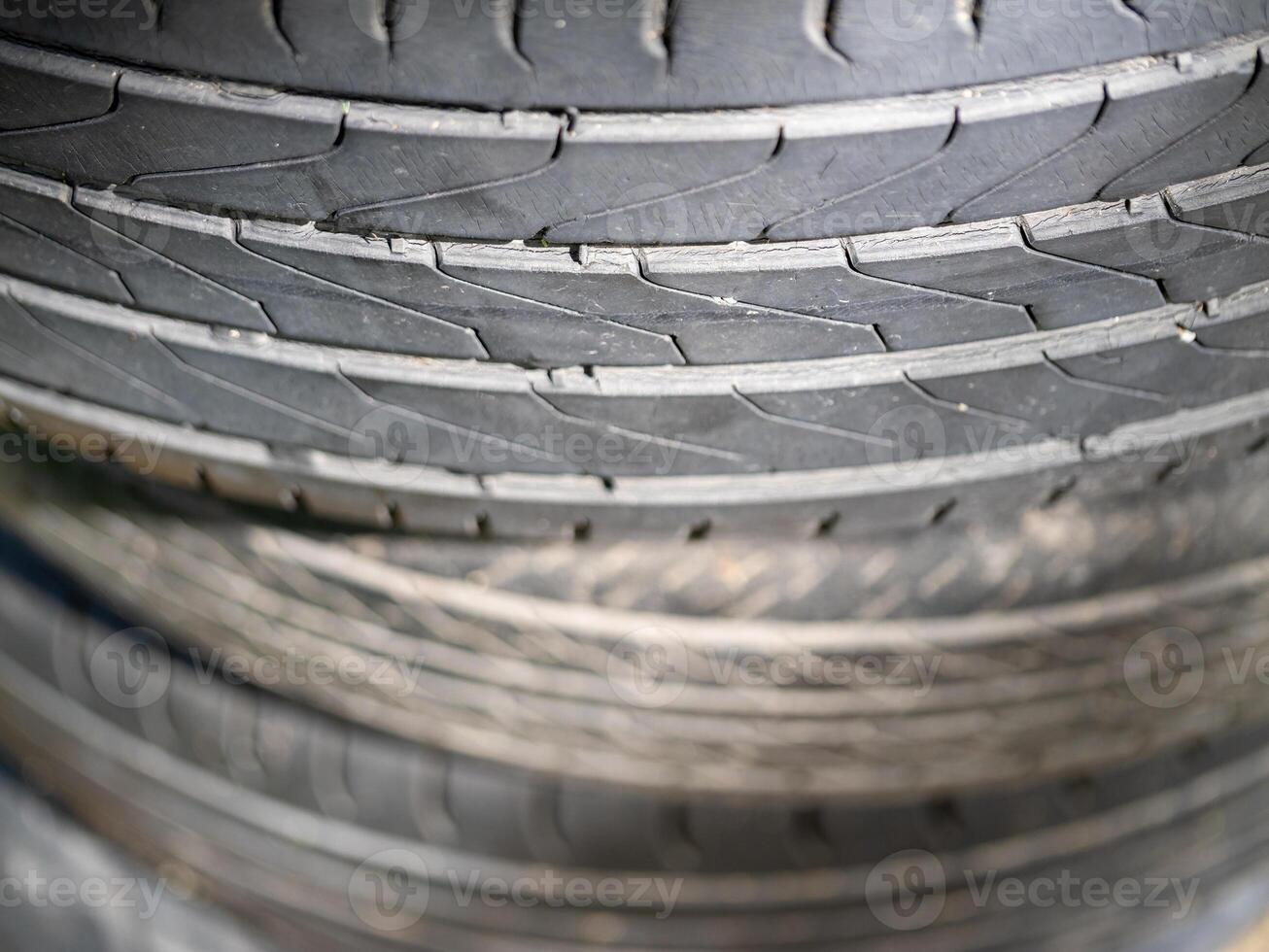Tread patterns of used tires automotive workshop close-up indoor elevated angle industrial concept photo