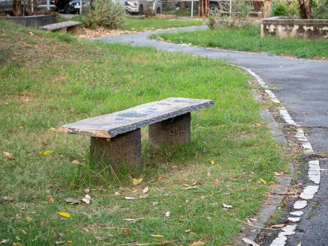 Relaxing park bench in urban landscape nature scene outdoor setting peaceful view photo