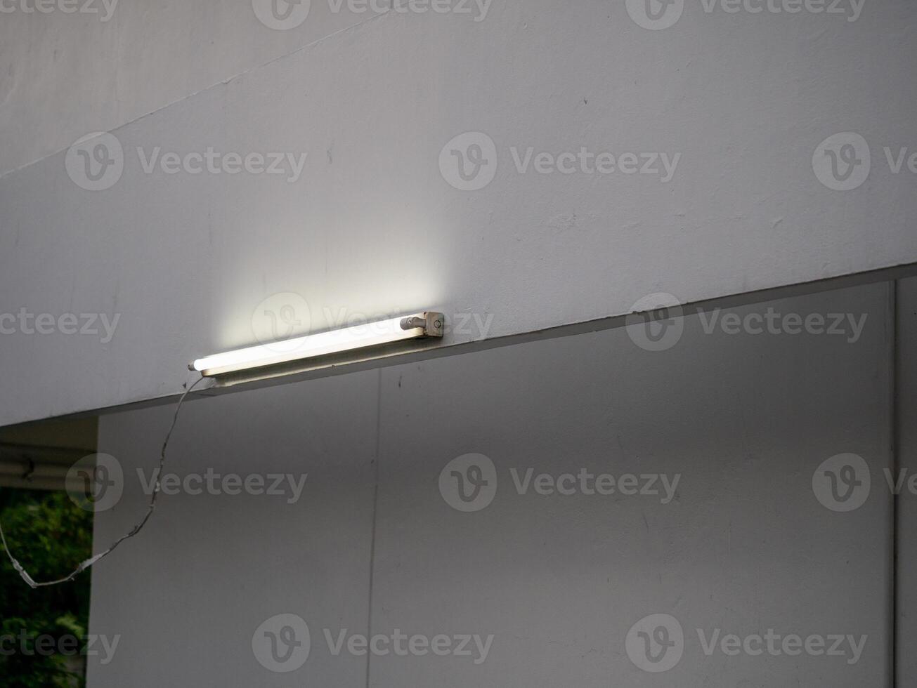 Illuminated light fixture installation indoor space modern environment close-up design concept photo