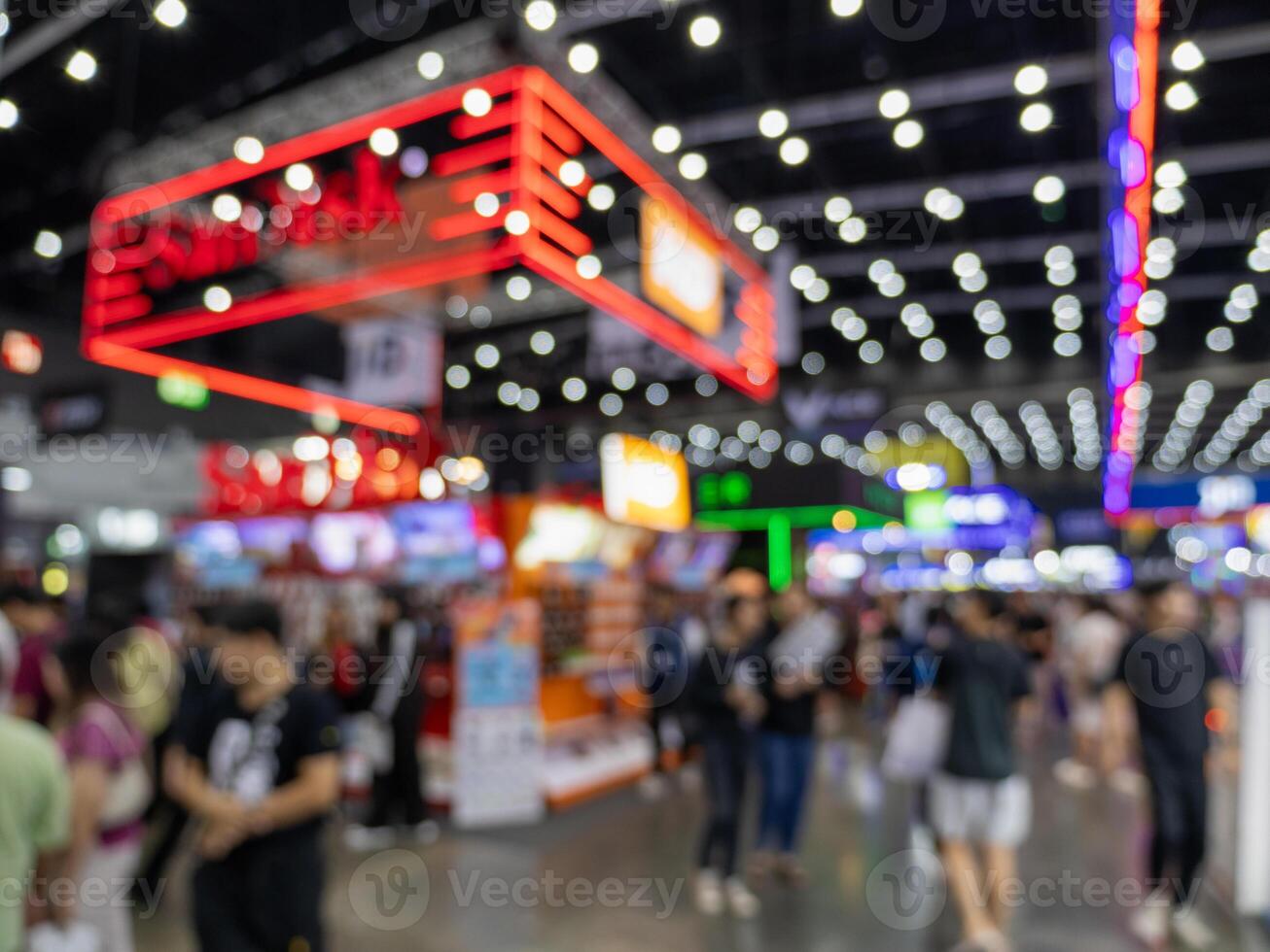 Wide angle view vibrant trade show and business networking at urban convention center photo