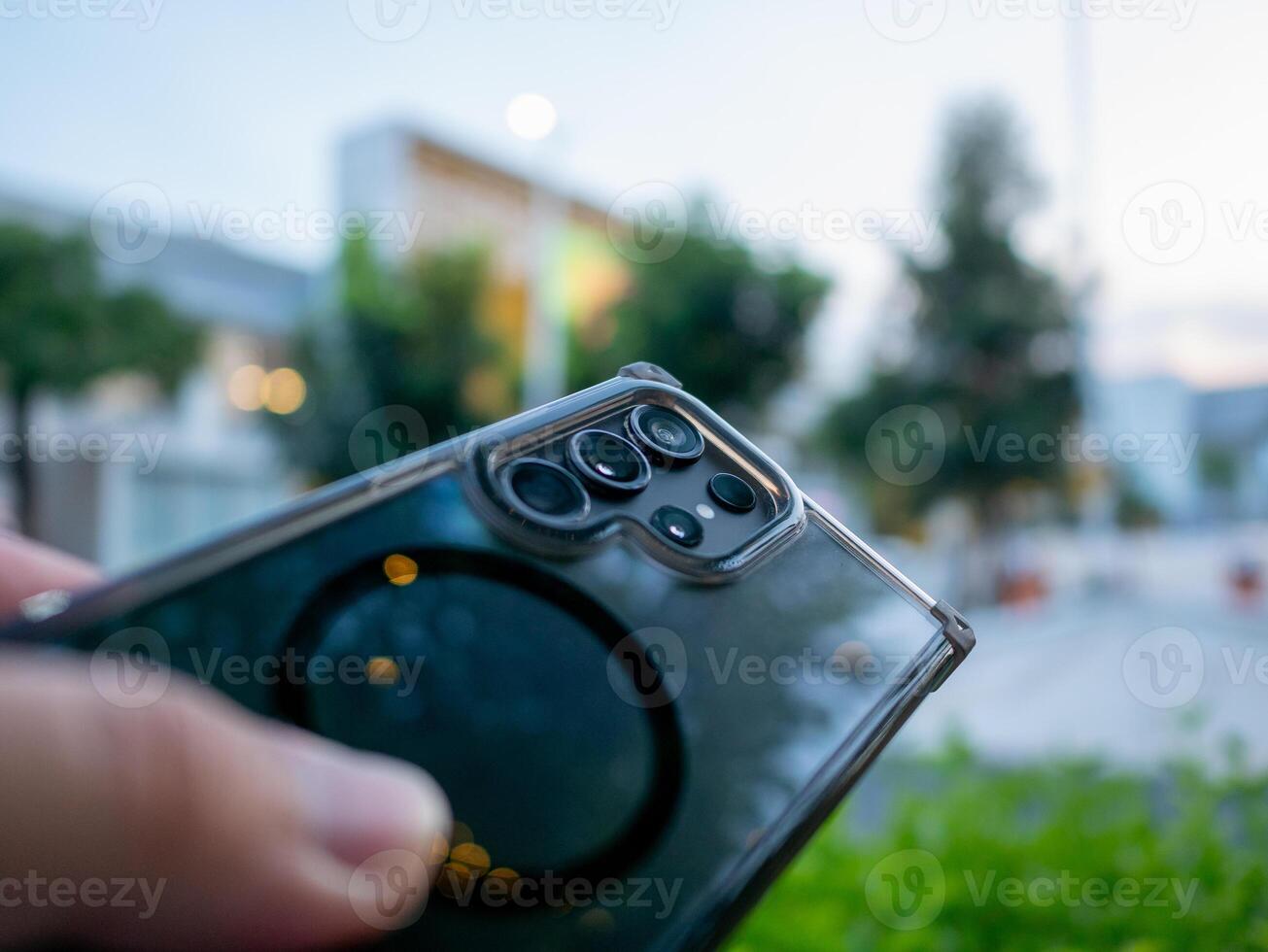 Smartphone capture urban setting technology image evening light close-up view modern lifestyle photo