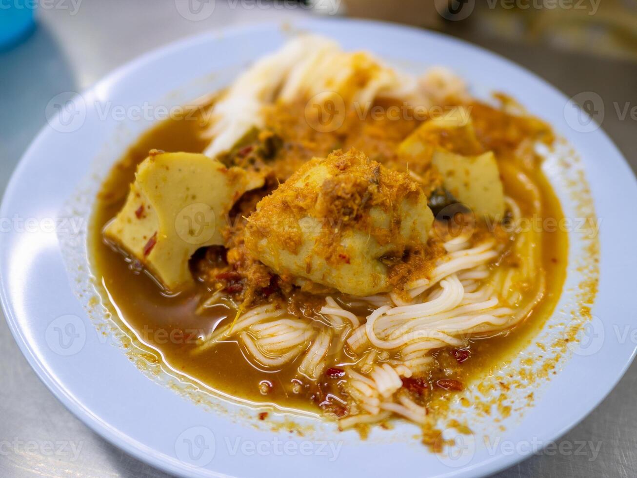 Savoring urban curry noodles a close-up culinary experience at local eatery photo