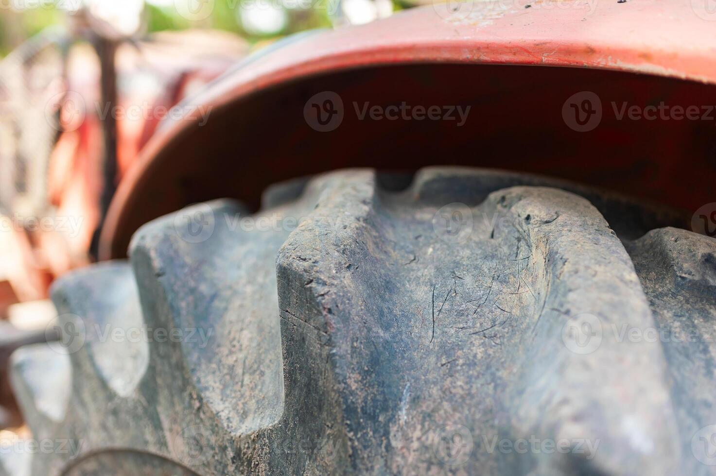 Tractor tire close-up farm location high-resolution image rural environment ground level viewpoint photo