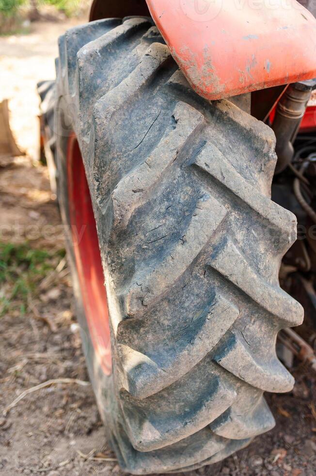 Tractor tire close-up farm field rural environment ground level agriculture insights photo