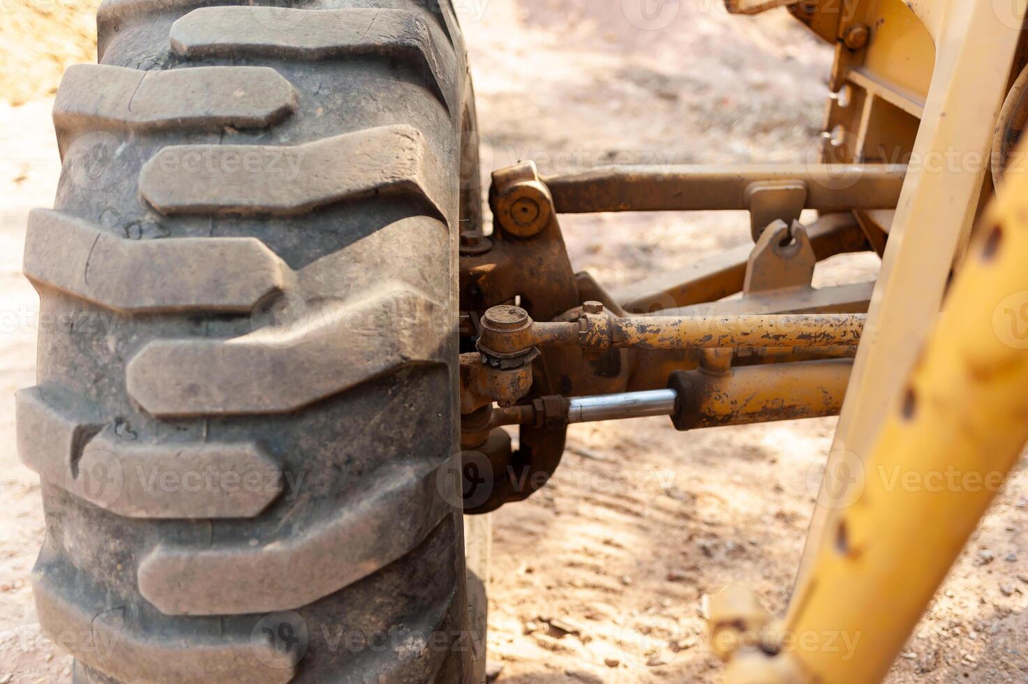 Ground-level view of heavy machinery action in industrial construction environment close-up focus photo