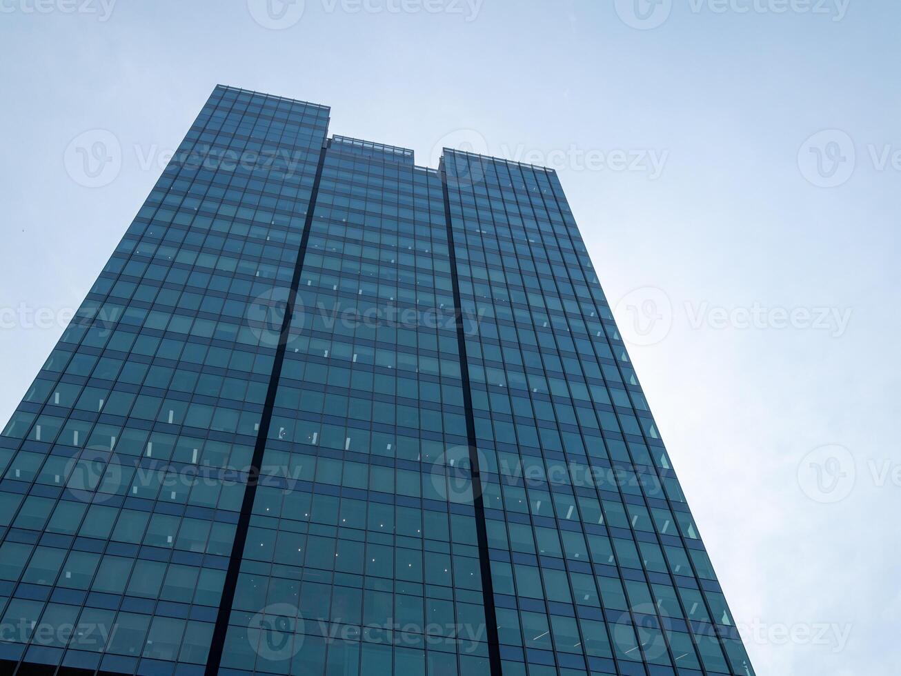 Contemporary skyscraper design in urban landscapes a low angle architectural perspective photo