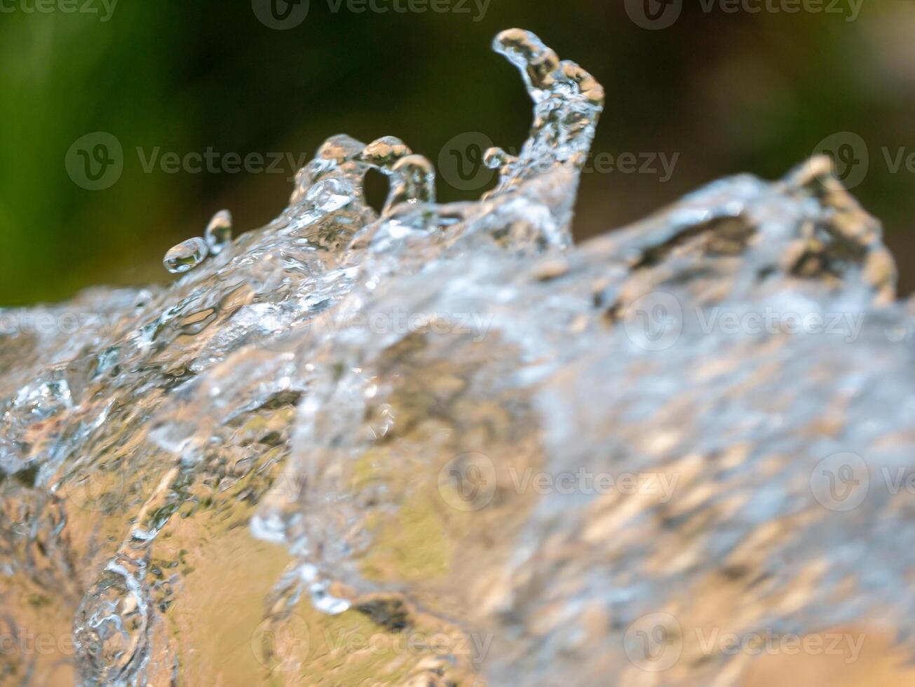 Dynamic water splash close-up exploring fluid motion in a vibrant outdoor environment photo