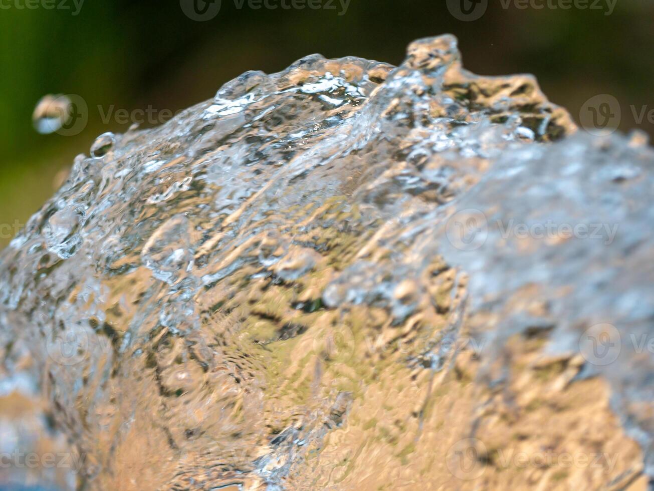 Dynamic water splash outdoor setting nature close-up perspective fluid motion photo