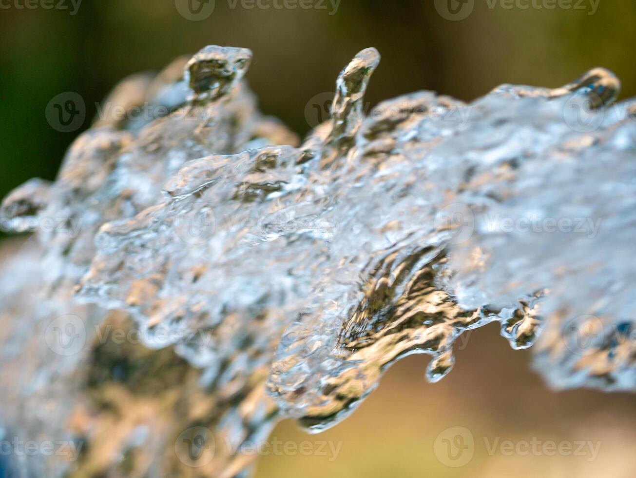 Dynamic water flow outdoor fountain nature urban environment close-up motion capture photo