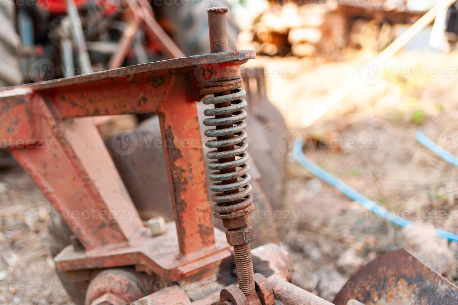 Industrial equipment spring mechanism workshop close-up outdoor ground level machinery insights photo