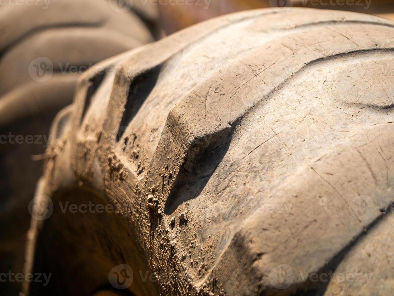 Heavy machinery action close-up of tire construction site industrial urban environment photo