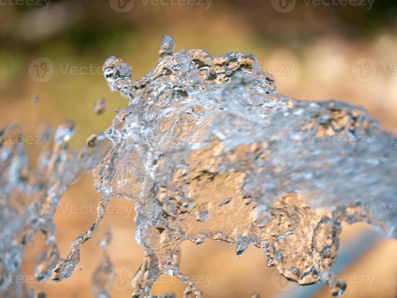 Water splashes in motion nature setting outdoor environment close-up view fluid dynamics photo