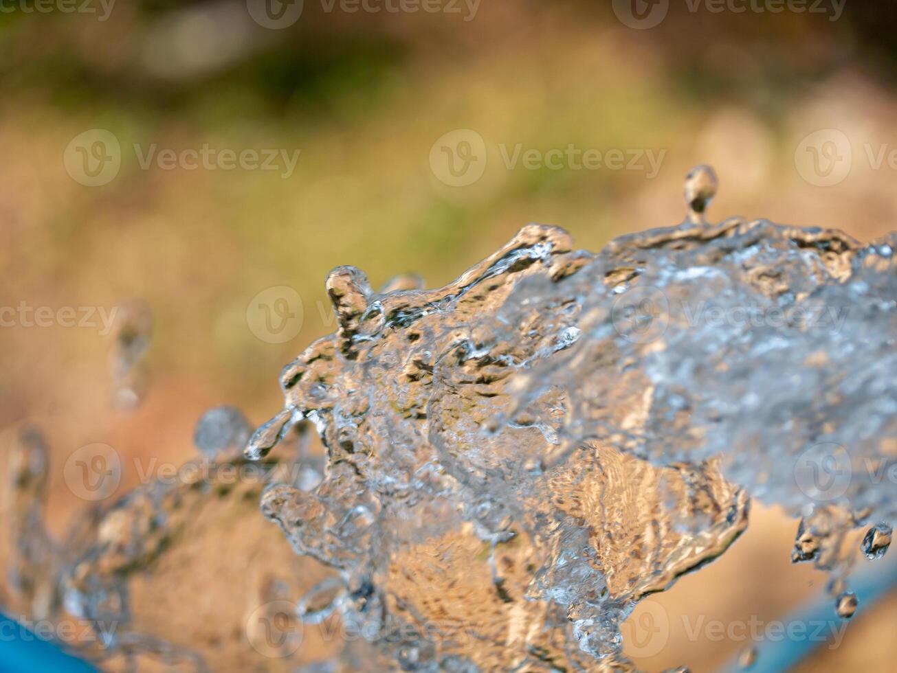 Dynamic water splash captured in nature's beauty outdoor vibrant environment close-up view photo