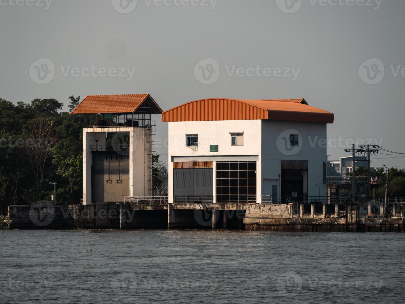 Industrial structure by the river urban location building daytime serene environment photo