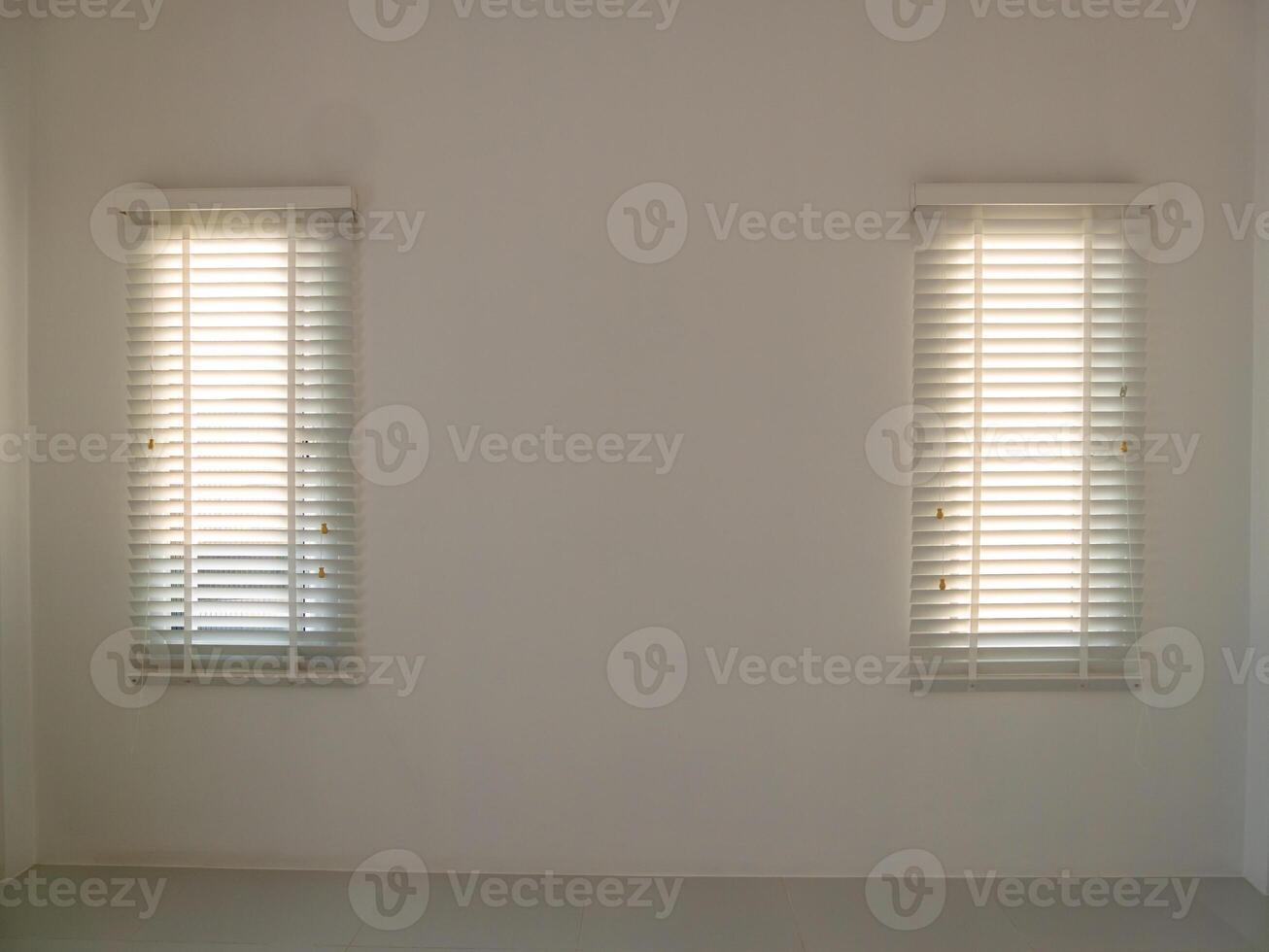 Illuminated minimalist space white walls and blinds create a bright environment photo
