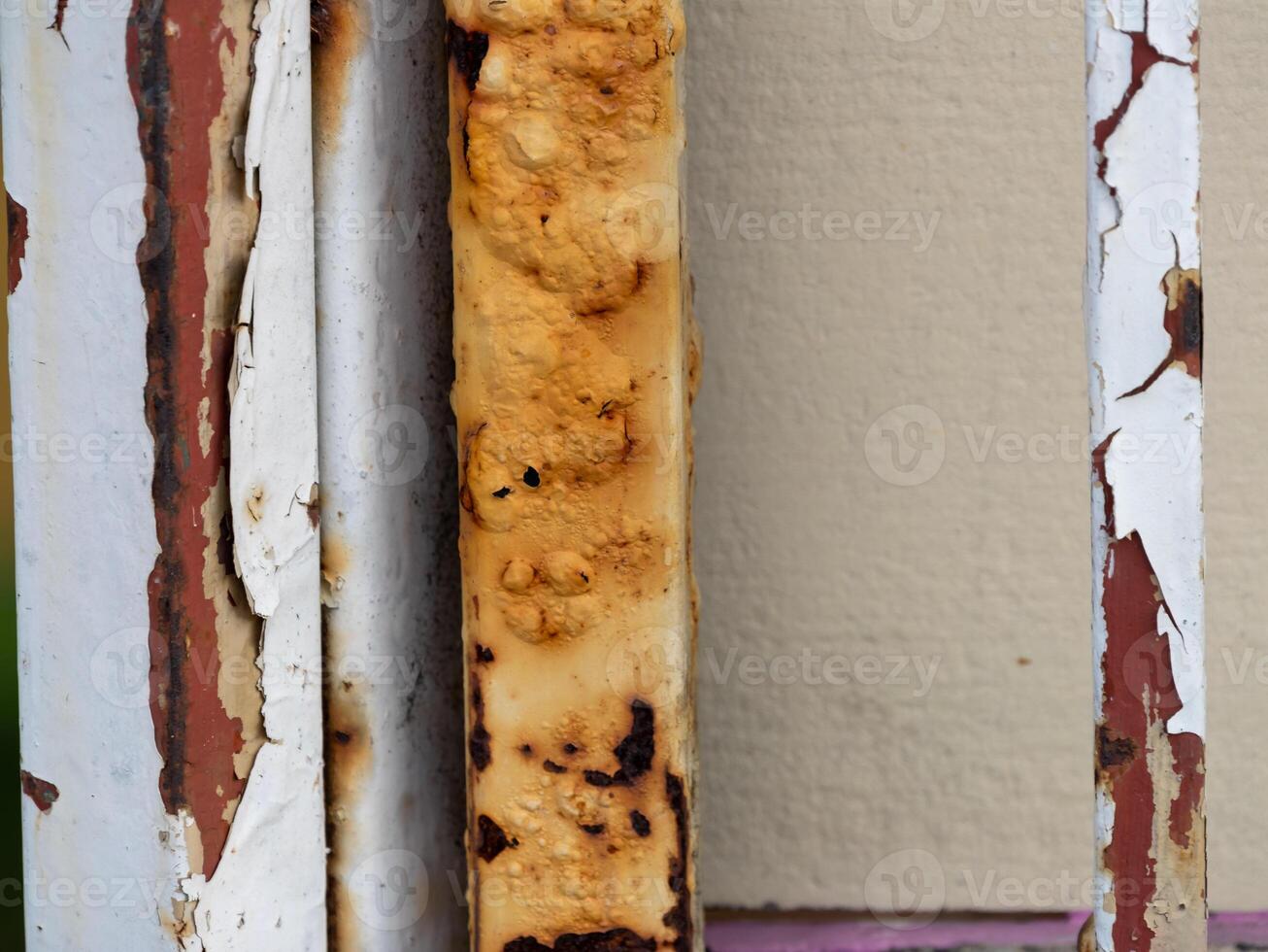 Rusty metal bars urban environment close-up weathered texture details photo