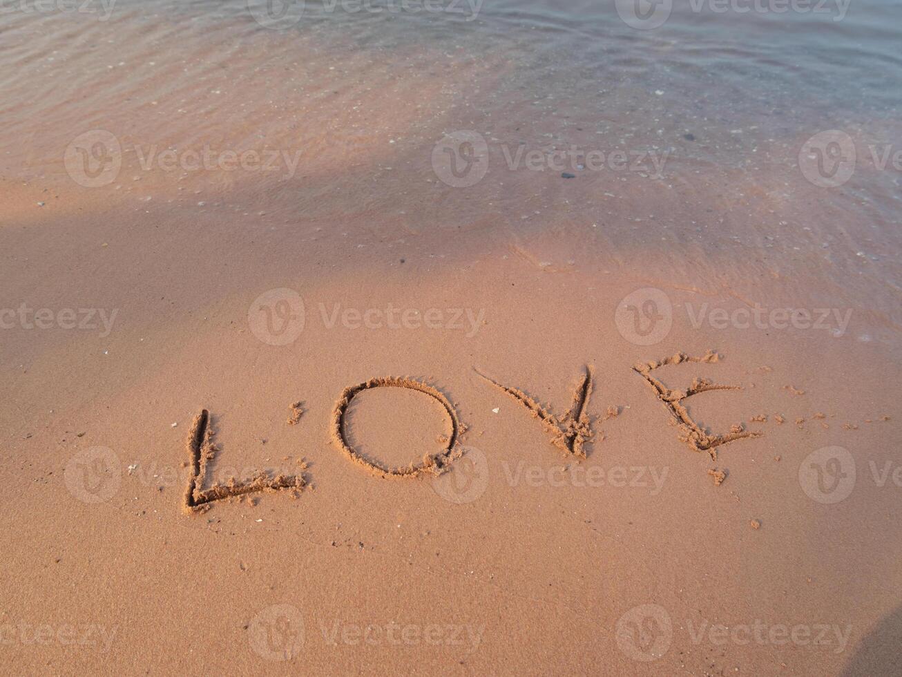Beach love message coastal shore sand art romantic setting close-up heartfelt expression photo