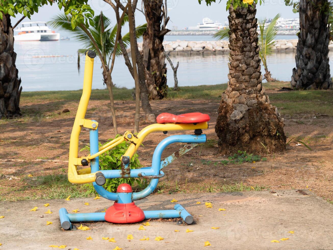 Ground-level outdoor fitness equipment coastal park for health and wellness photo