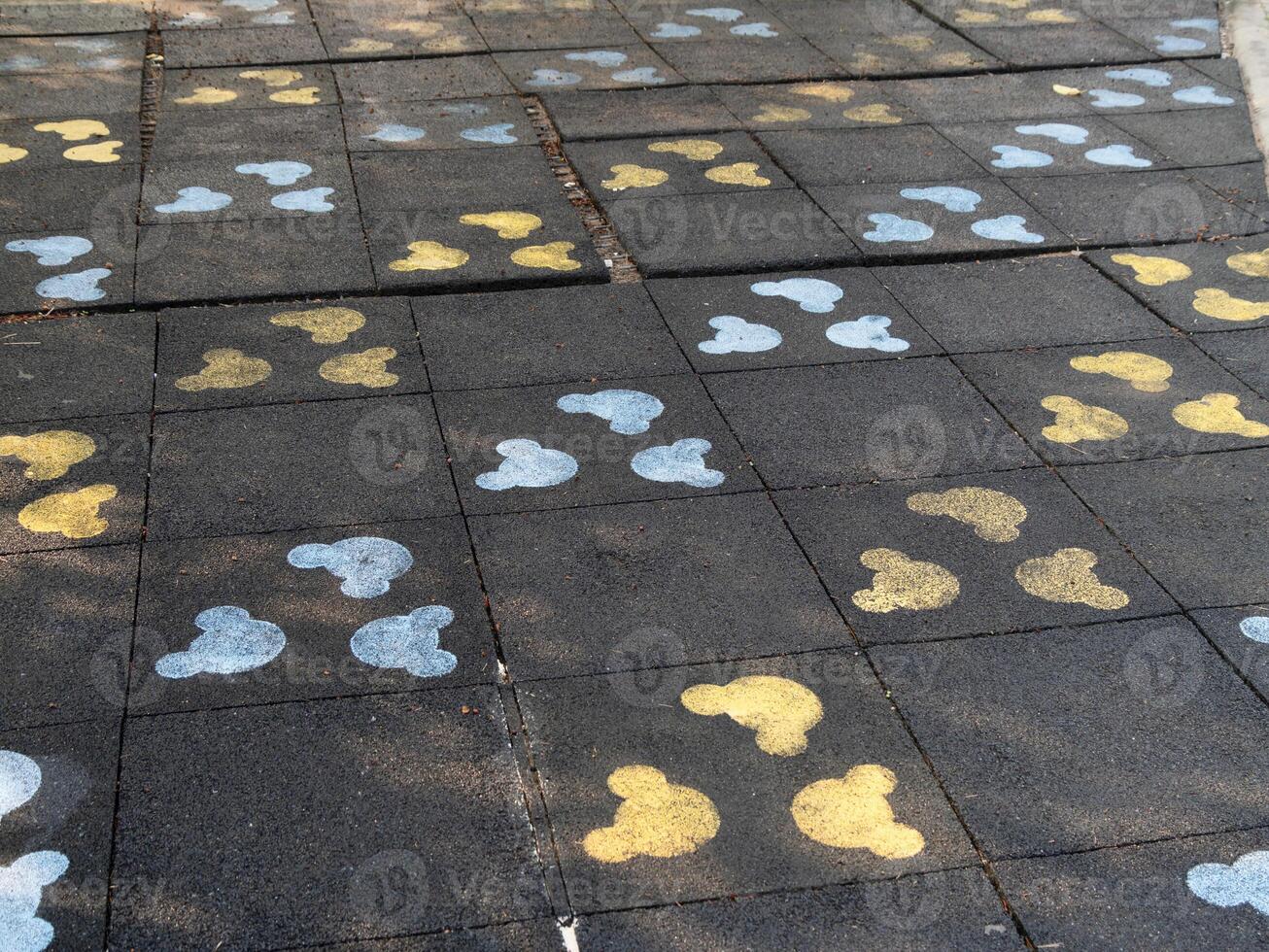 Colorful footprints paved path urban park outdoor ground level playful concept photo