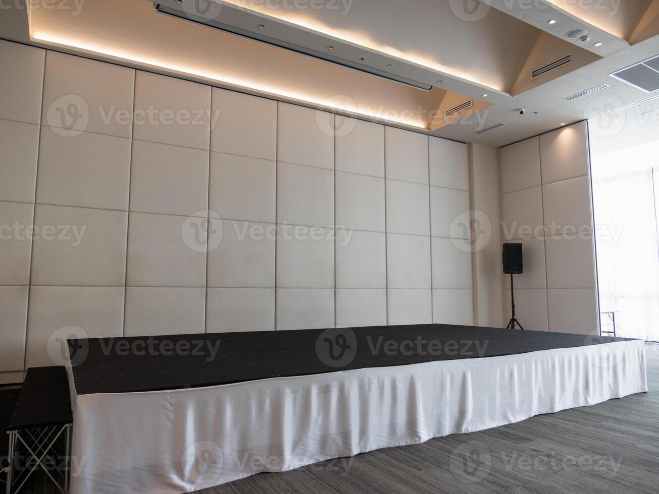 Event stage setup for corporate presentation modern venue professional atmosphere wide angle view photo