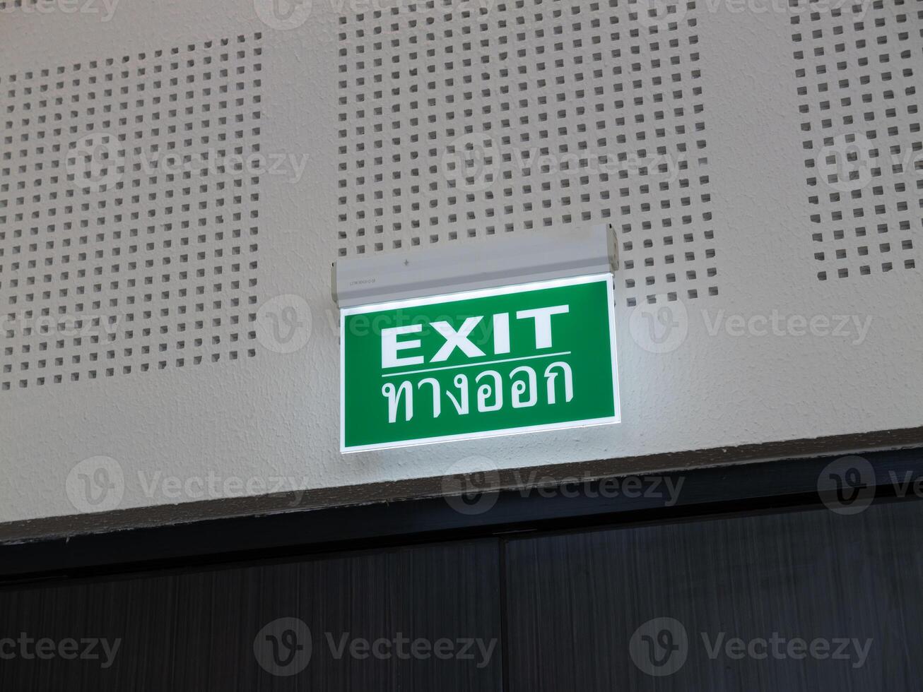 Emergency exit sign public building safety signage indoor straight view navigational guidance photo