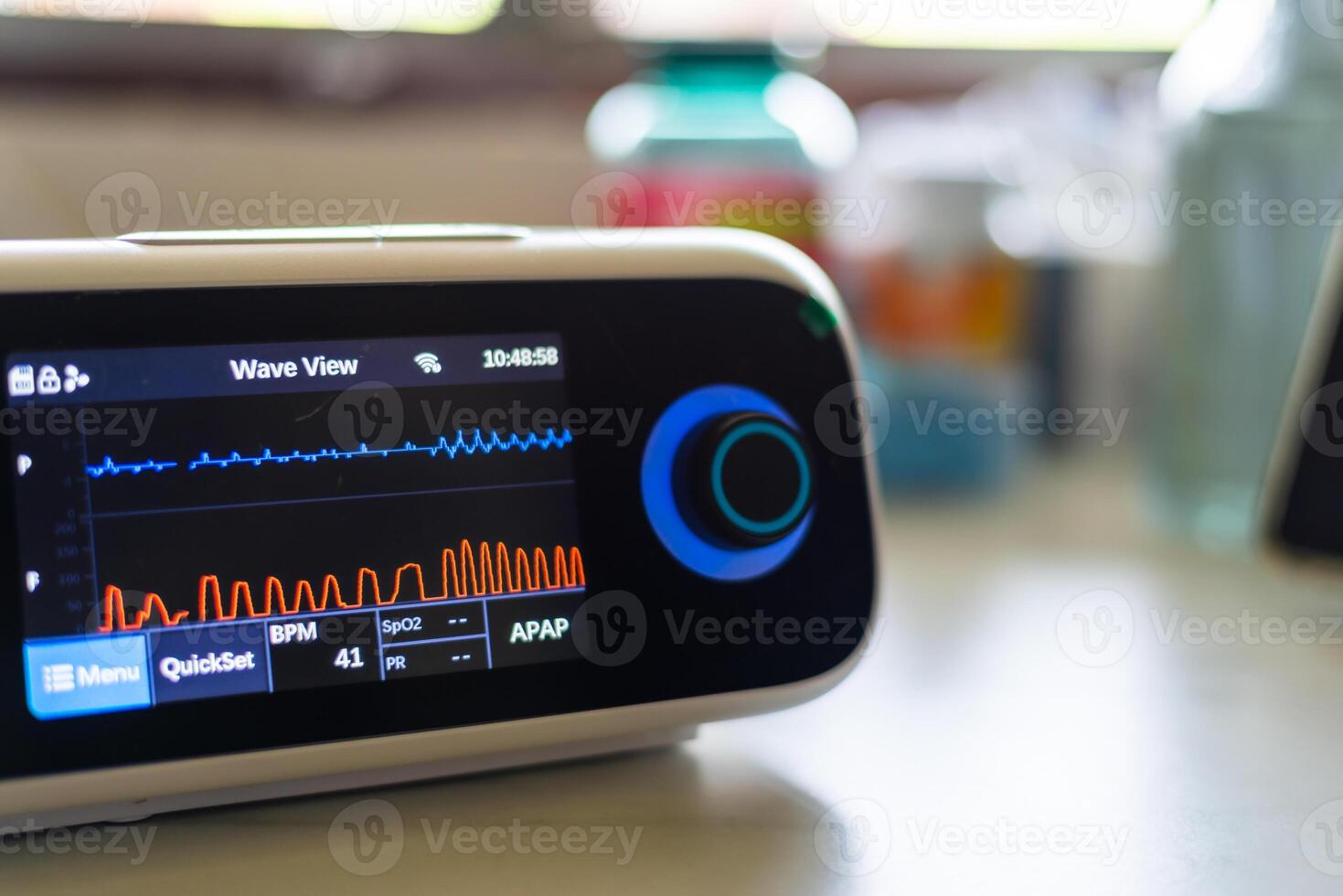 Monitoring health metrics medical device displaying data clinical environment photo