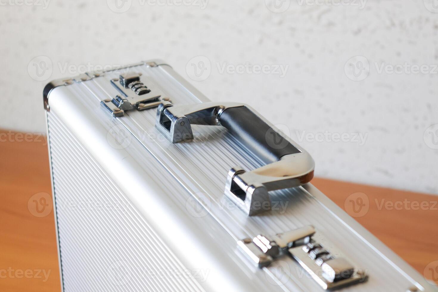 Business case with silver handle office environment product image close-up view professional concept photo