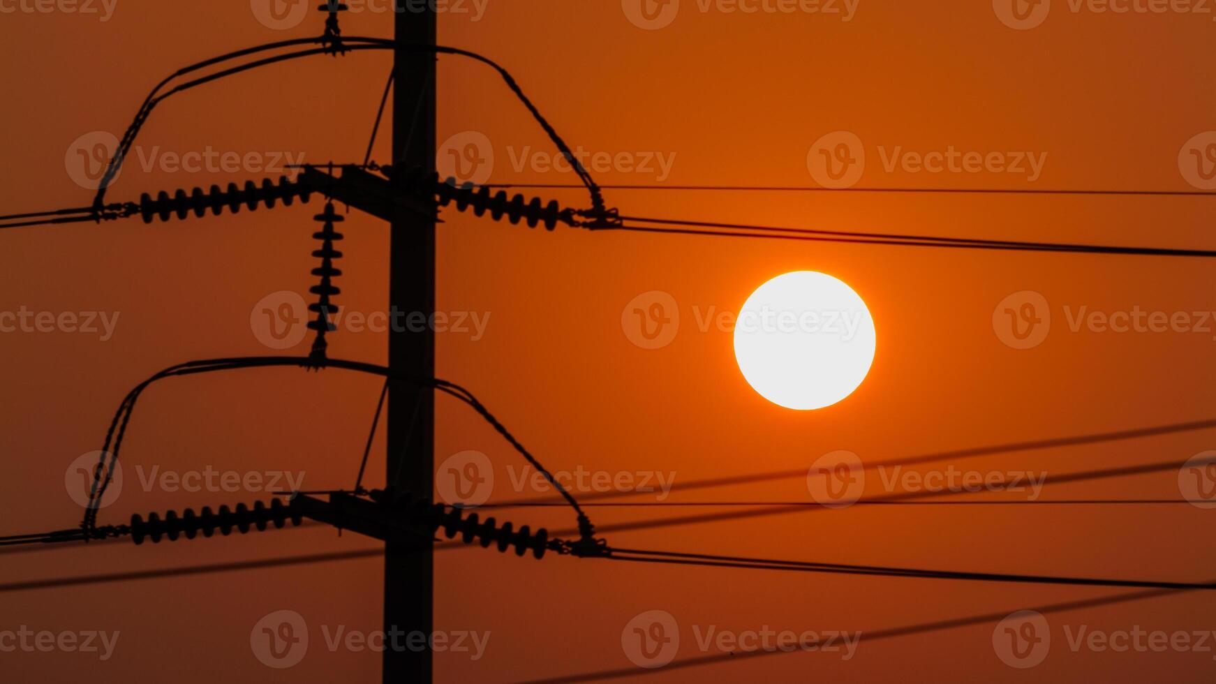 Sunset view over power lines energy infrastructure urban landscape evening horizon photo