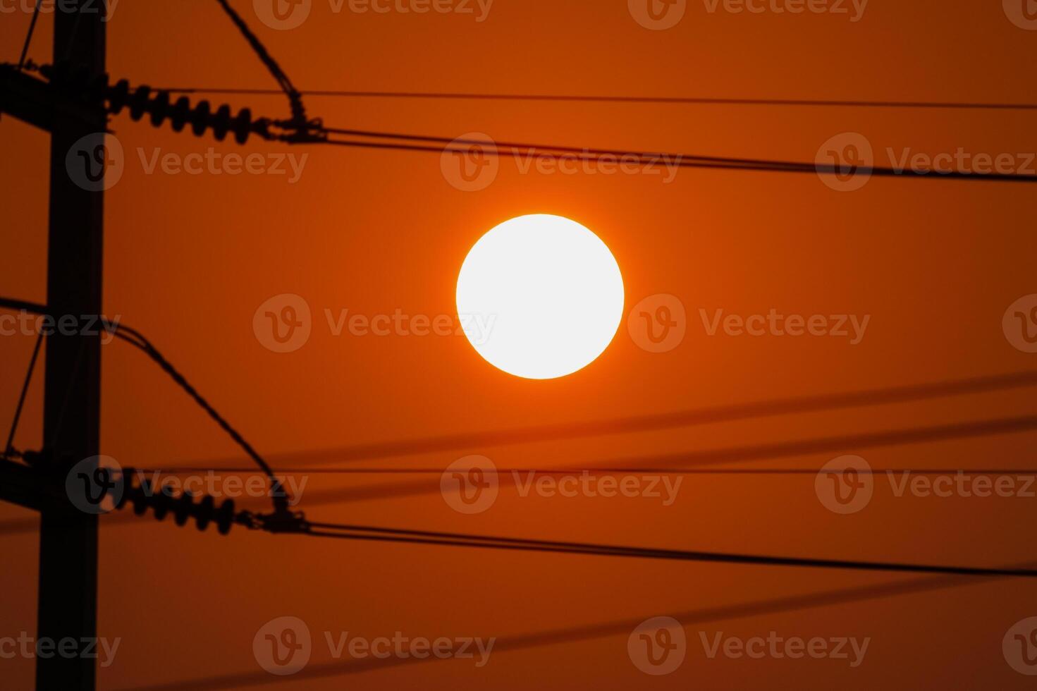 Sunset over power lines urban landscape nature evening glow captured serenity photo
