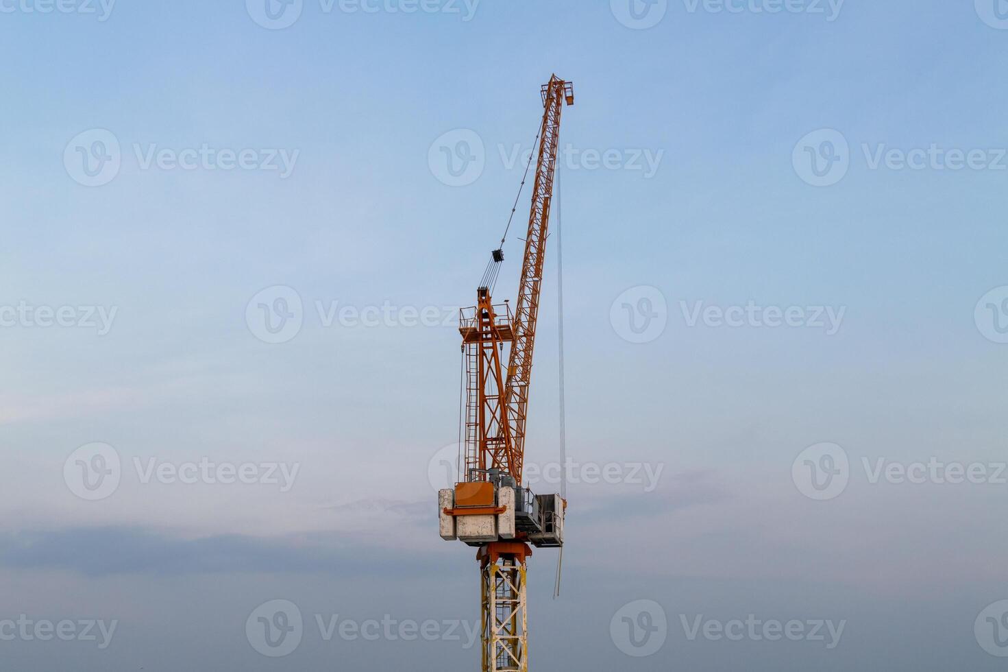 Construction site activity urban environment crane operation daytime industrial perspective photo