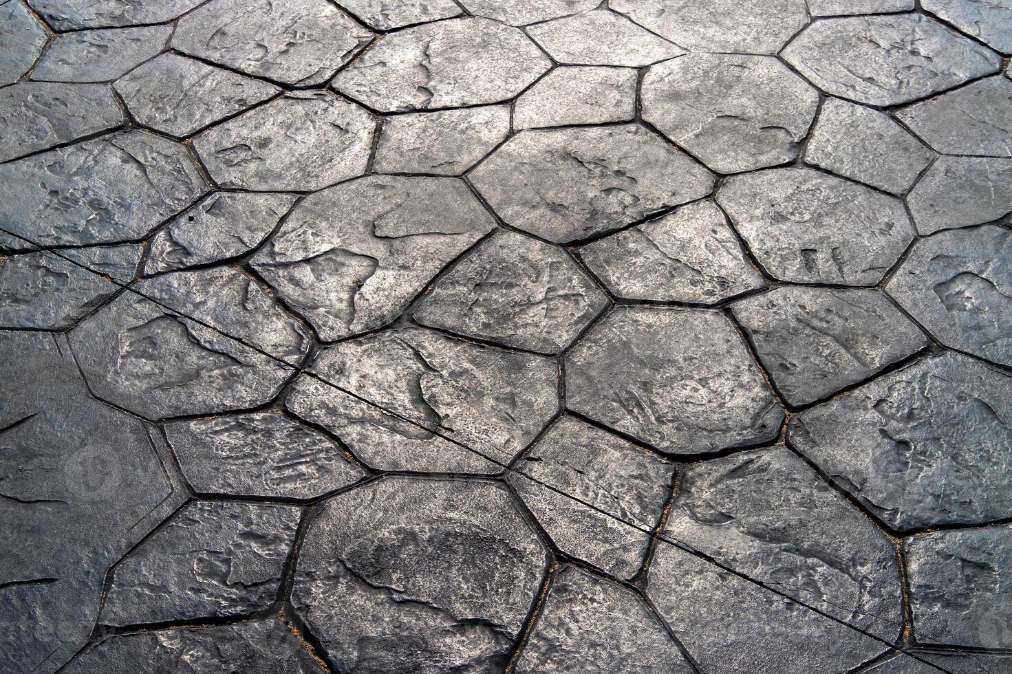 Textured stone pavement pattern urban setting natural light close-up artistic composition photo