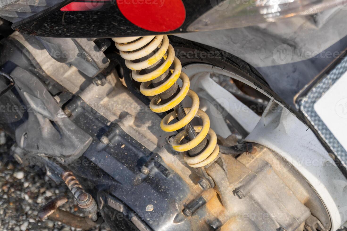 Mechanical workshop close-up motorcycle suspension system detailed engineering view photo