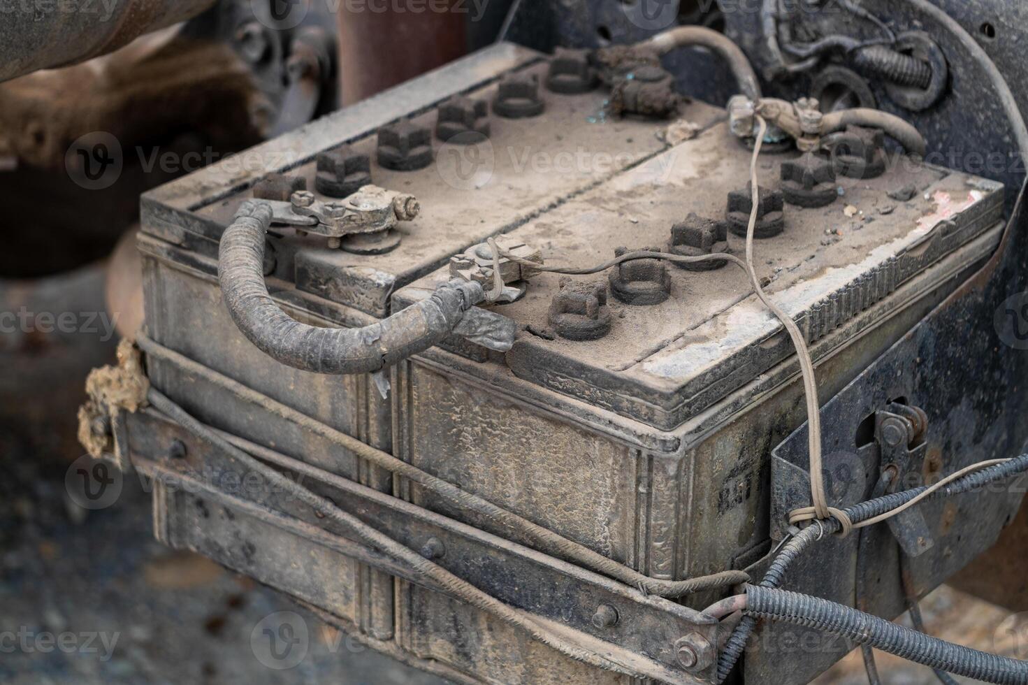 Maintenance of vintage vehicle battery garage technical insight dusty environment close-up view photo