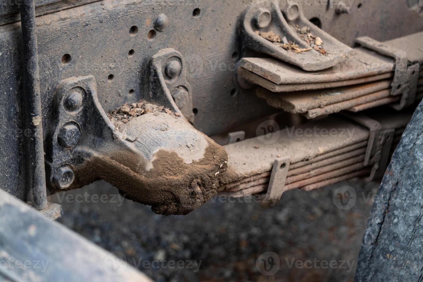 Industrial workshop macro heavy-duty truck suspension system close-up photo