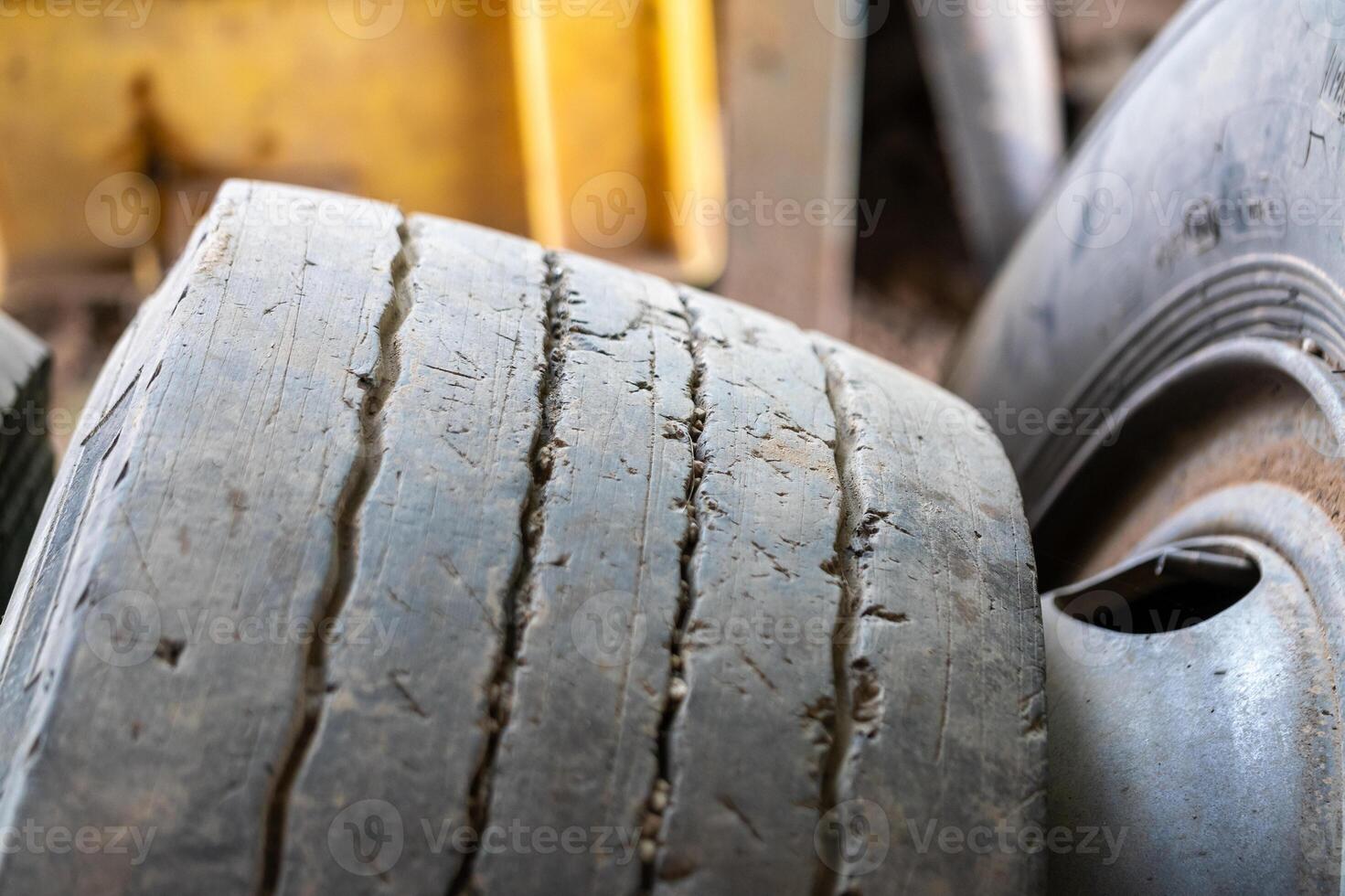 Worn out tires in an industrial setting close-up view of damage workshop environment photo