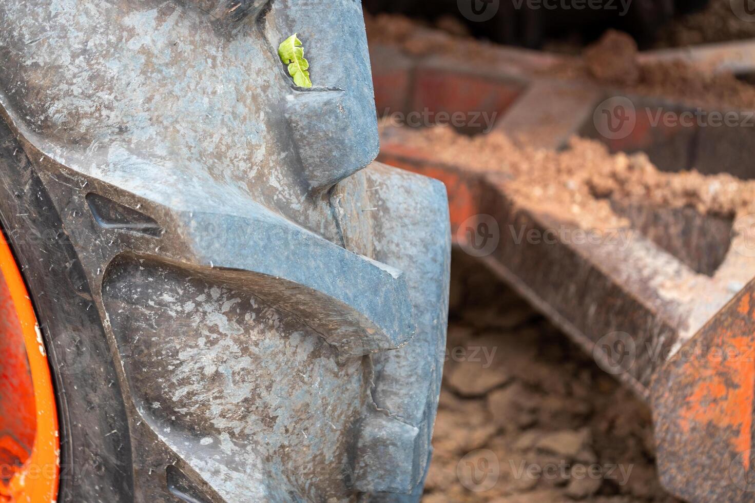 Tractor wheel close-up agricultural field earthy environment detailed view machinery concept photo