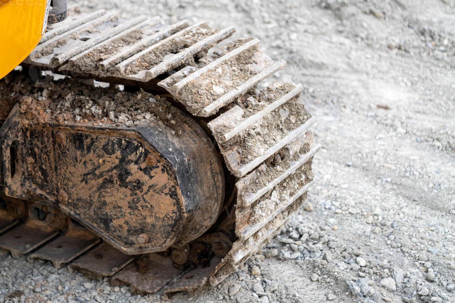 Excavation work progress construction site equipment close-up industrial setting ground level view photo